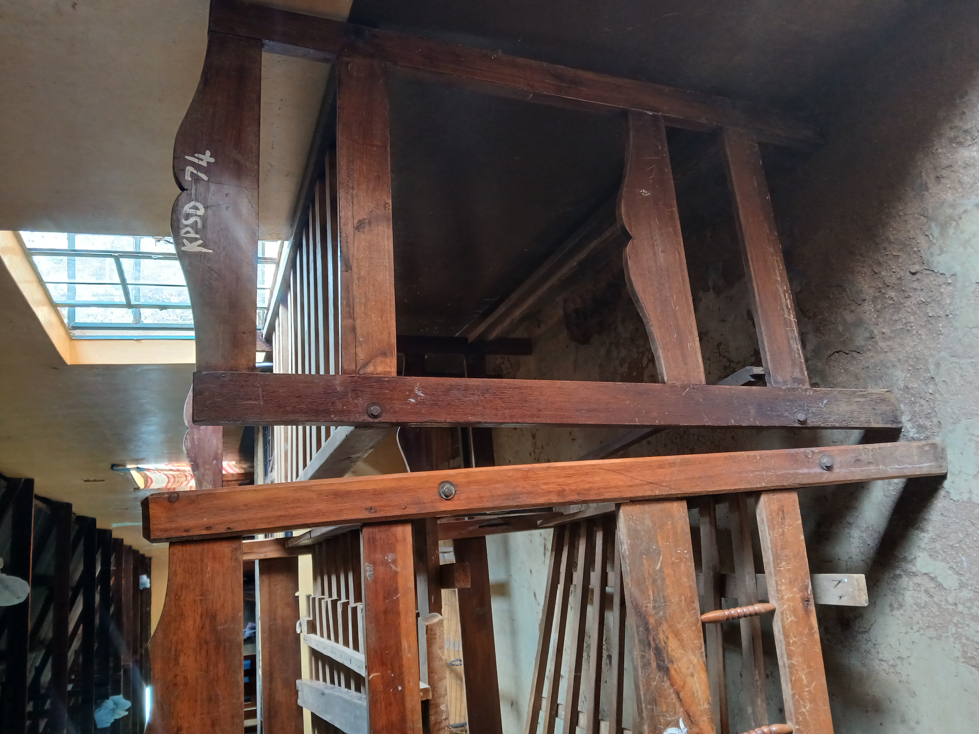 Worn out timber beds in girls dormitory